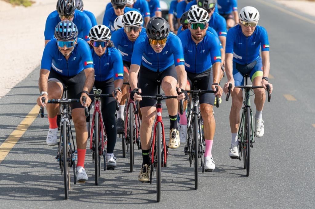 The First Group 7 Emirates Cycle Challenge team and Sheikha Madia bint Hasher bin Mani Al Maktoum approach the finish line - from left to right: Vitor Carvalho, a former member of the UAE National Olympic Cycling Committee; Sheikha Madia bint Hasher bin Mani Al Maktoum; Samuel “Samu” Sánchez, Olympic Gold Medallist; Vlad Shevchenko former professional road racing cyclist; and Jani Brajkovič, the world’s under-23 Time Trial former champion. 