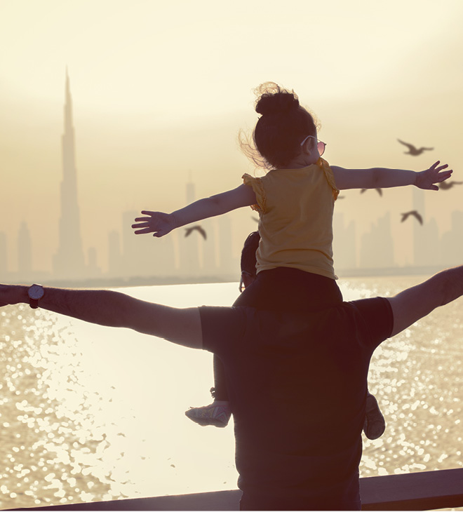 Father and Daughter having fun on sunset