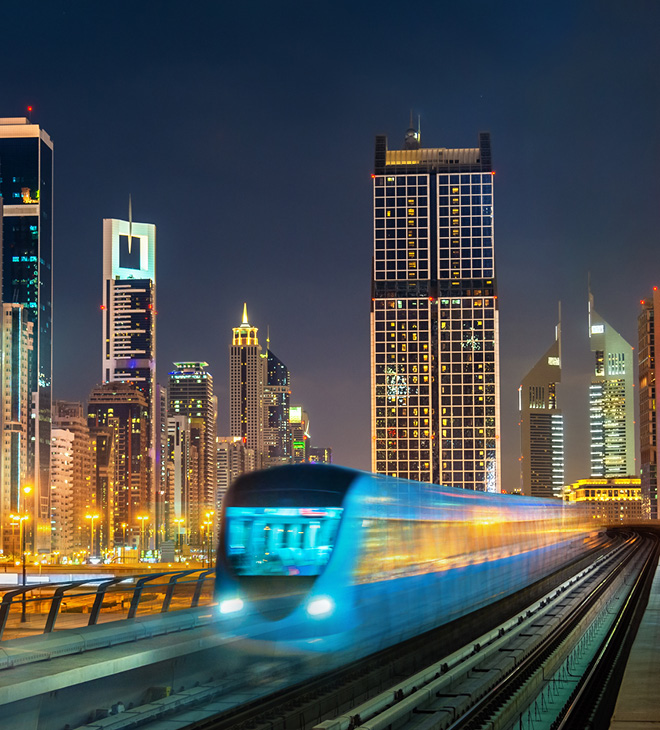 Dubai Metro with a skyline of Dubai 