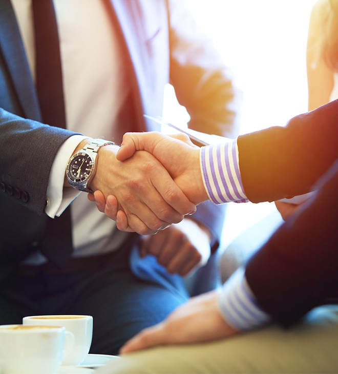 Two business men shaking hands